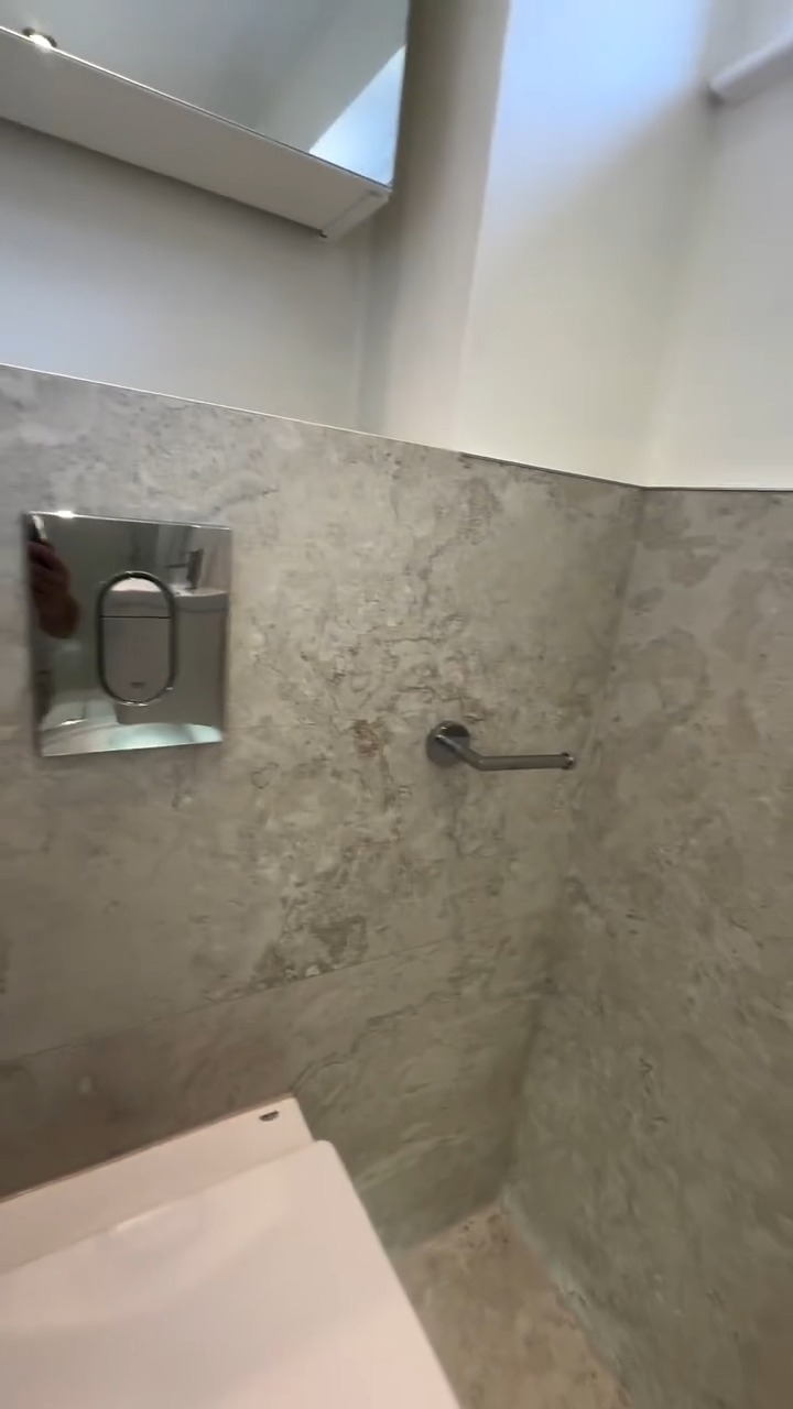 Shower enclosure with sliding door and tiled walls